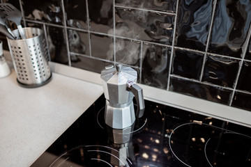 Coffee brewed in a geyser coffee machine on the kitchen