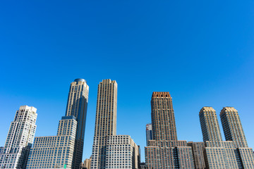 Fototapeta na wymiar Skyscrapers in the Lincoln Square New York City Skyline with a Clear Blue Sky