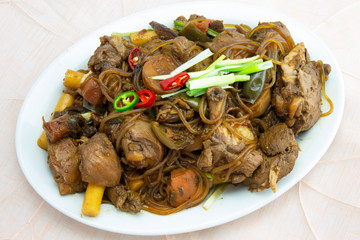 Korean chicken stew with soy sauce, glass noodle, rice cake and vegetables