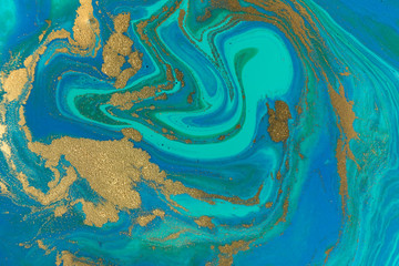 Fototapeta na wymiar Marbled blue and gold abstract wave background in ocean style.