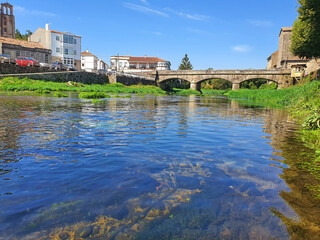 Summer river and old bridge