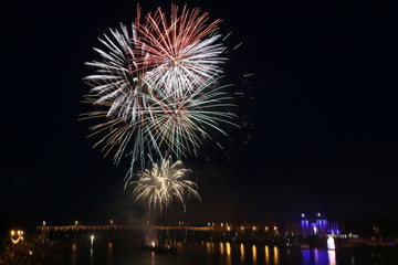 Salute on city day in Tver on the background of the bridge over the Volga river