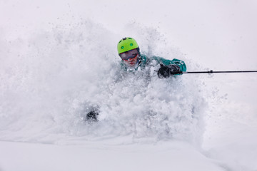 Freerider is buried in fresh snow, turning and jumping between the trees. freeride skiing in deep powder snow. Chest deep snow during snow storm. Good powder day. Funny skiing. Freeride skier rides