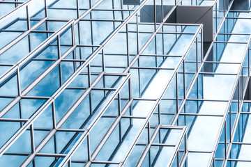 underside panoramic and perspective view to steel blue glass high rise building skyscrapers, business concept of successful industrial architecture