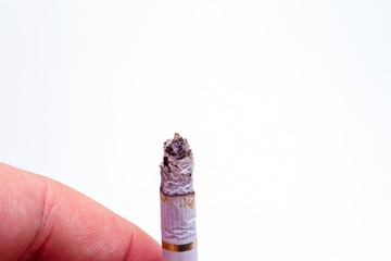 Burning cigarette isolated over white