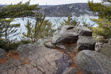 Fototapeta na wymiar Rock formations on the cliffs above a lake along east bluff trail at a state park in Wisconsin