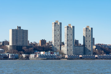 Fototapeta na wymiar Skyline of West New York and Guttenberg New Jersey with a Clear Blue Sky along the Hudson River