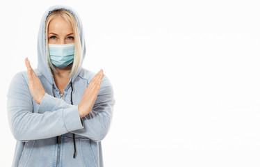 Woman wearing face mask. Concept coronavirus, respiratory virus. Sign with hands stop