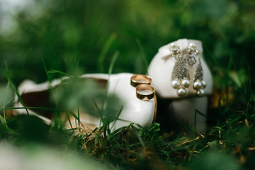 wedding shoes and wedding bouquet of white roses