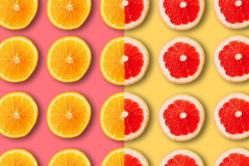 summer pattern with juicy ripe fresh orange and grapefruit on a yellow and pink background