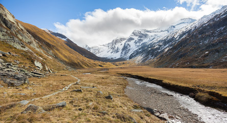 walking at fall in a mountain valley