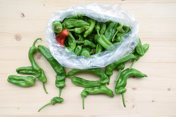 Fresh BIO Green Peppers on Wooden Table
