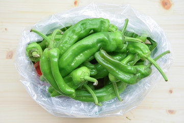 Fresh BIO Green Peppers on Wooden Table
