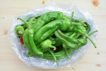 Fresh BIO Green Peppers on Wooden Table
