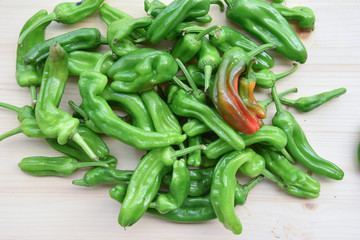 Fresh BIO Green Peppers on Wooden Table
