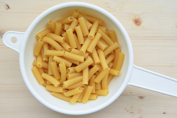 Italian Macaroni in the Bowl on Wooden table