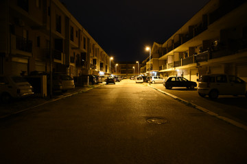 Fototapeta na wymiar Night Illuminated Street and Buildings