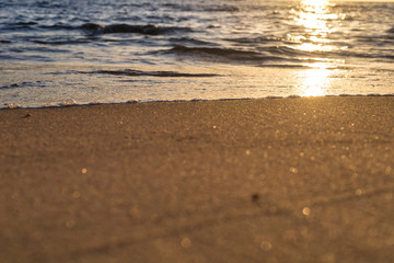 Soft wave from sea come to wet sand beach background. With copy space for text or design