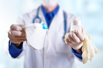 Doctor showing individual protection elements