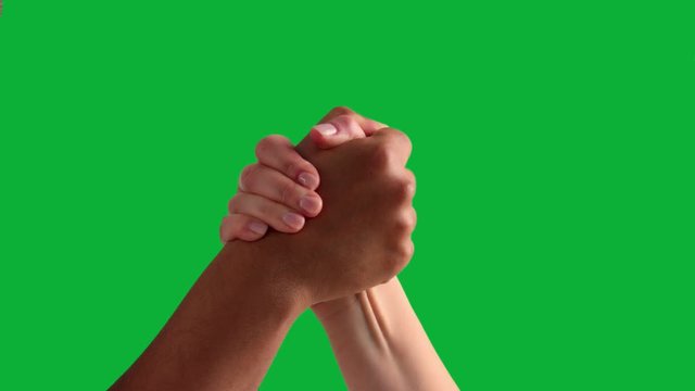 arm wrestling between male hand and female hand with different skin tones on green chromakey one click keying