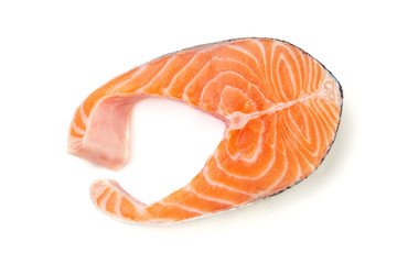 Fresh uncooked red fish steak over white