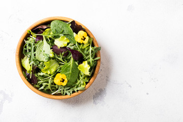 Salad from a fresh mix of leafy greens. Antiviral healthy food. Vitamins.