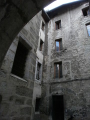 Chambéry, France - August 5th 2011 : Focus on very old facades of a medieval court, in the city center.