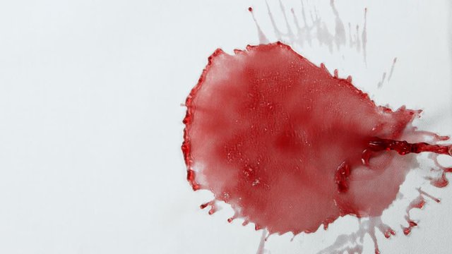 Super Slow Motion Top Shot of Splashing Red Wine on White Cloth at 1000fps.