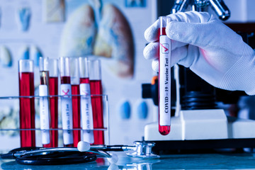 Medical or scientist or doctor holding tube with nCoV Coronavirus vaccine for protect Covid-19 virus