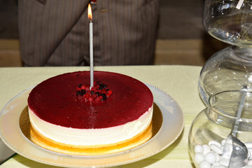 Bithday Cheesecake on the Table With Candle On