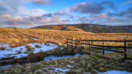 Fence and Gate marks the Scottish Border in the Cheviot Hills, at Brownhart Law, a summit on the...