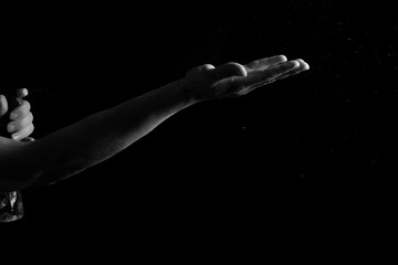 Obraz premium hand holding a bottle