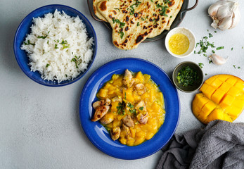 mango curry with chicken and cashew, garlic naan flatbread  and rice