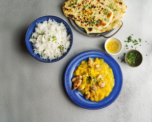 mango curry with chicken and cashew, garlic naan flatbread  and rice