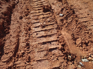 The mark of heavy vehicle tires that have gone through a soft ground area.