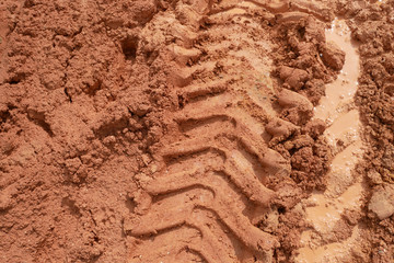 The mark of heavy vehicle tires that have gone through a soft ground area.