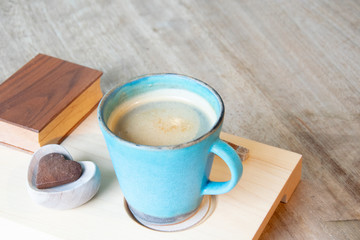 Hot Cappuccino In Cup On Wooden Table With Copy-space. The Latte Art On coffee background.