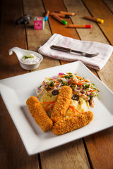 children meal fish fingers with mashed potato and mixed salad