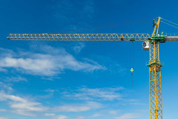 construction crane landmark industrial object high view vivid blue sky background space for copy or your text here in poster concept