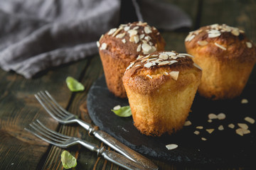 Fresh muffins with marzipan and almonds