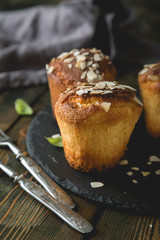 Fresh muffins with marzipan and almonds