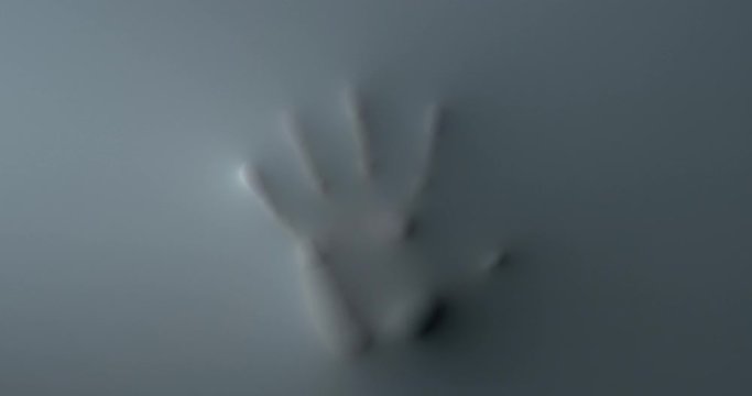 The appearance of the silhouette of the palm of the hand in the wall