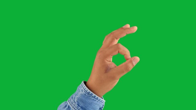 male hand lift up showing ok gesture on green chromakey one click keying