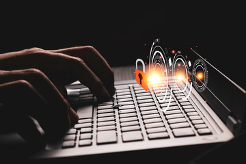 Hand press typing on keyboard to unlock passwords or access to computer laptop. Cyber security...