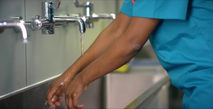Female Medical Worker Washing Hands
