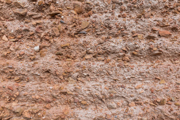 old earth and small stone wall of a construction