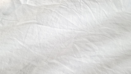 Fototapeta na wymiar Wrinkle white Linen fabric cover the bed
