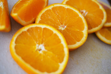 Naklejka na ściany i meble Slices of sweet orange on the table