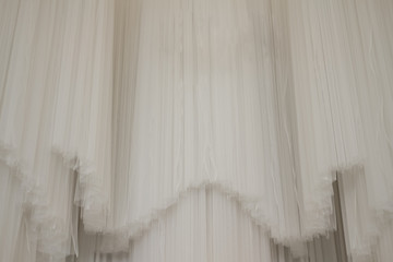 Fototapeta na wymiar Wedding background decorated with transparent white curtains