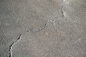 Background of asphalt with one crack